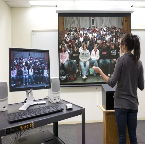 A woman presenting a lecture