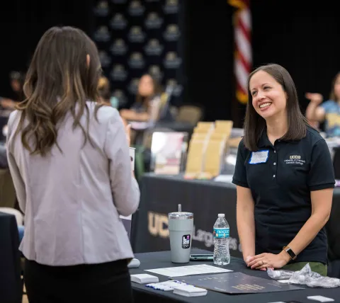 Student and admissions counselor talking 