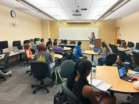 a lecture being delivered in a classroom full of students